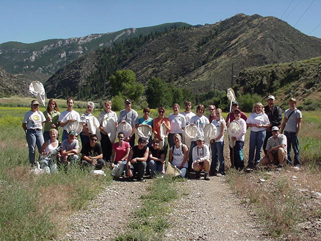 Terri Burt is the Noxon biology teacher.  She is in the summer class of 2005.  Terri is standing 8 people from the left.